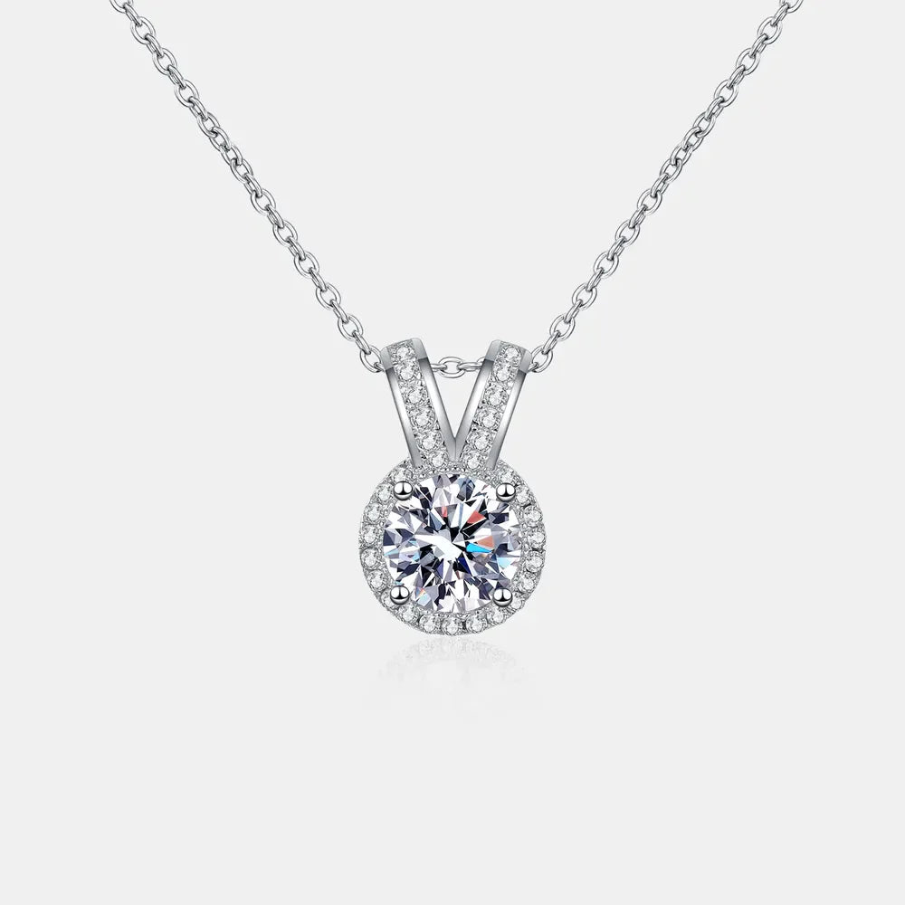 Silver halo diamond pendant necklace with rabbit ear detail on 925 sterling silver chain.