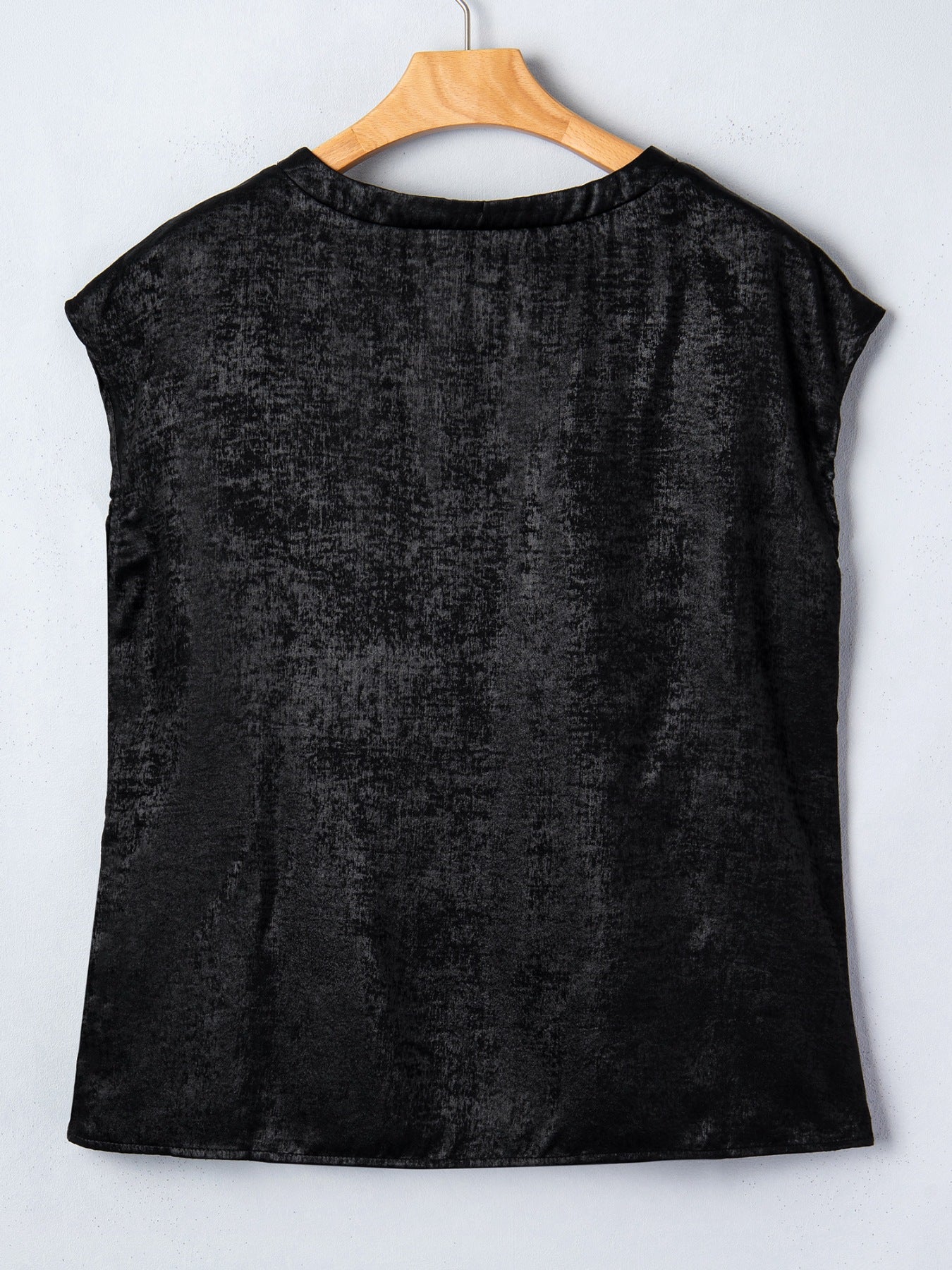 Black metallic tee with cap sleeves and round neck, textured polyester blend.