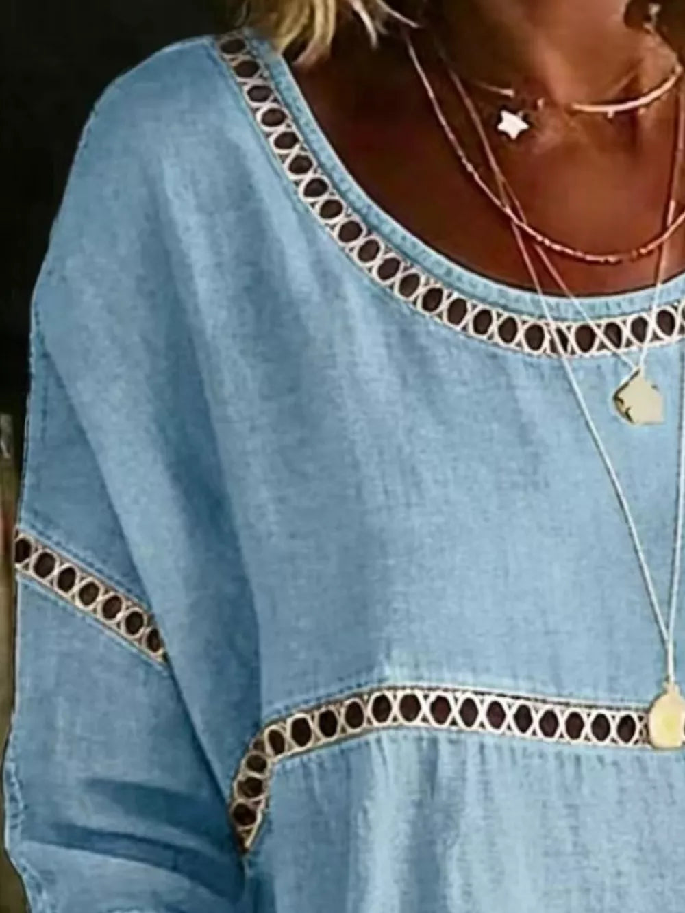 Sky blue maternity t-shirt with openwork floral trim at neckline and hem.