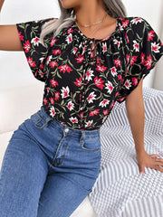 Black floral ruffle sleeve tie-neck blouse with red and white flowers