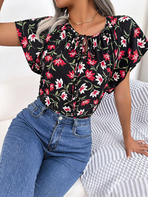 Black floral ruffle sleeve tie-neck blouse with red and white flowers