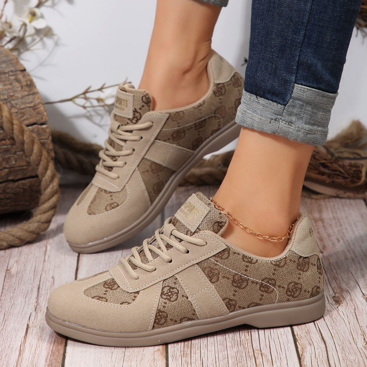 Chic lace-up sneakers in beige with monogram pattern and suede accents.