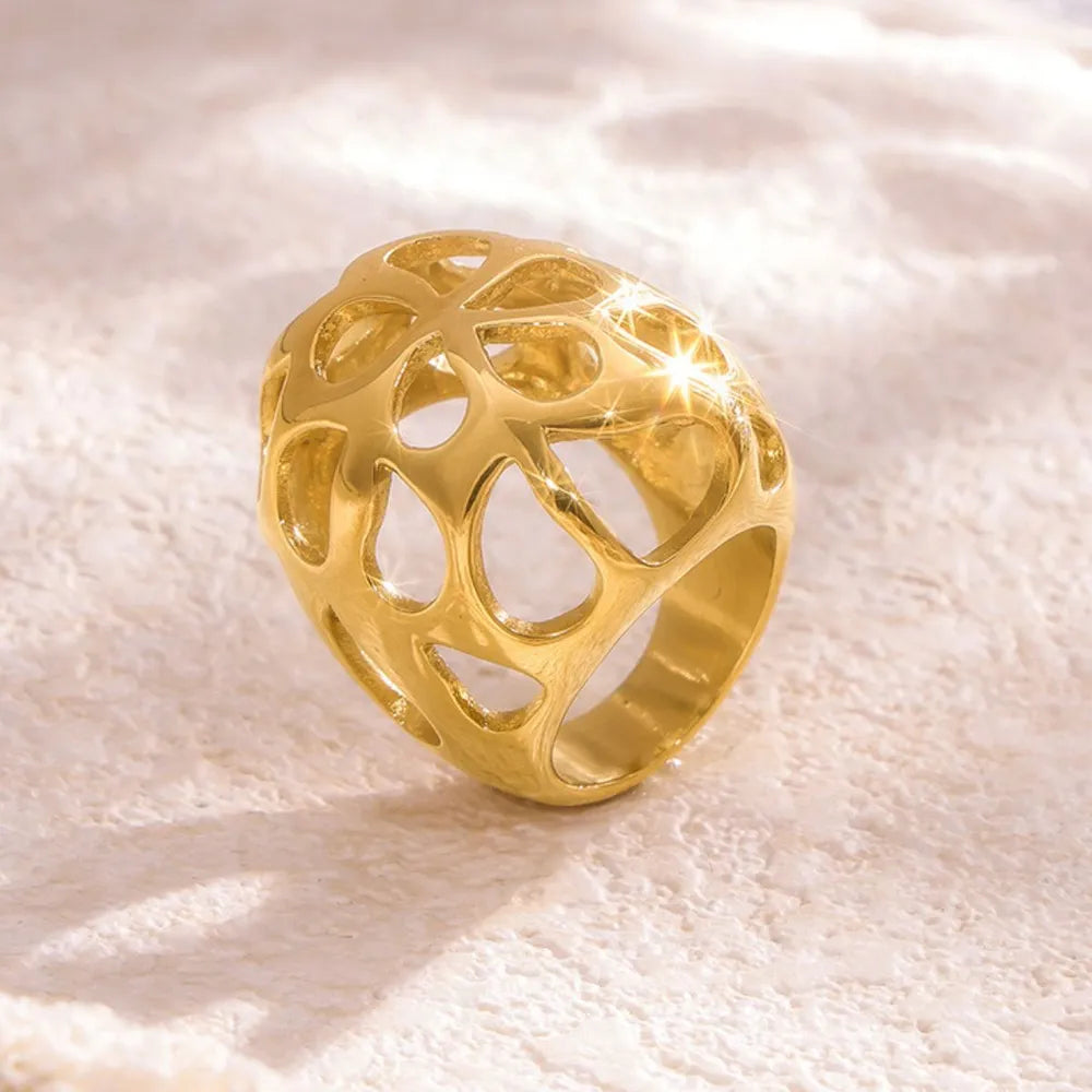 Gold openwork orb ring with a contemporary, hollow design.