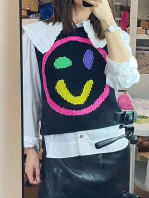 Black knit tank top with colorful smiley face and ruffle collar detail