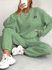 Textured cable knit loungewear set in Gum Leaf green, featuring a crewneck sweatshirt and relaxed pants.