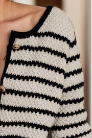 Textured Breton button-down cardigan in stripe acrylic with gold buttons and black trim.