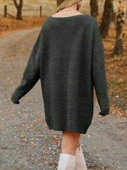 Dark gray ribbed knit oversized mini dress with long sleeves and a boat neck.