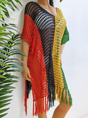 Colorblock crochet cover-up with fringe detail in red, black, yellow, and green.
