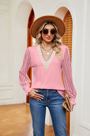 Pink knit v-neck blouse with lace sleeves and smocked cuffs