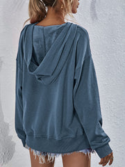 Dusty Blue boxy hooded sweatshirt with split hem and fuzzy lining detail.