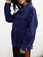Dark oversized denim trucker jacket with contrast stitching and buttoned front.
