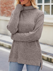 Ribbed turtleneck sweater in mocha with side slits and long sleeves, styled with jeans.