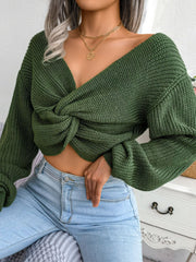 Olive green acrylic knit sweater with a deep V-neck and front knot detail.