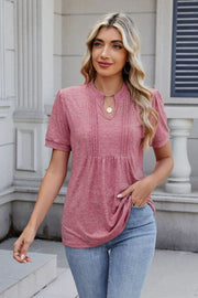 Dusty pink short sleeve blouse with pleated yoke and keyhole neckline