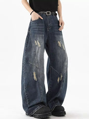 Distressed wide-leg denim jeans in Vintage Blue with a belt.