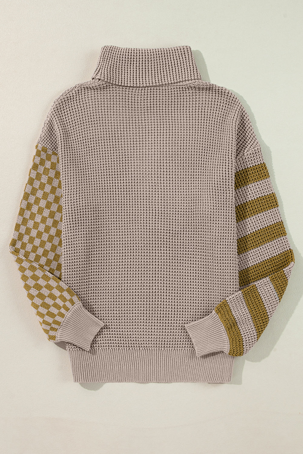 Checkerboard & stripe sleeve knit turtleneck sweater in mocha with a waffle knit body and ribbed cuffs.