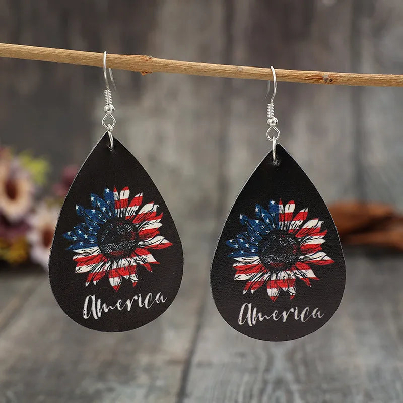 Black teardrop earrings with American flag sunflower design and "America" text