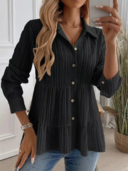Black textured tiered button-down shirt with crinkled fabric and button details.