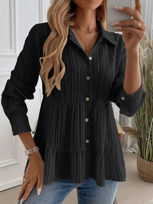 Black textured tiered button-down shirt with crinkled fabric and button details.