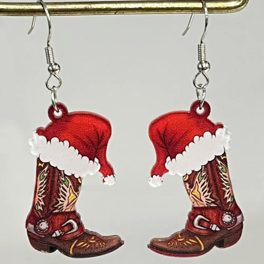 Festive acrylic novelty drop earrings with cowboy boot and Santa hat design