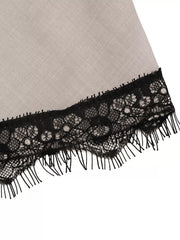 Luxe cami top in light grey with black lace trim and fringe detail.