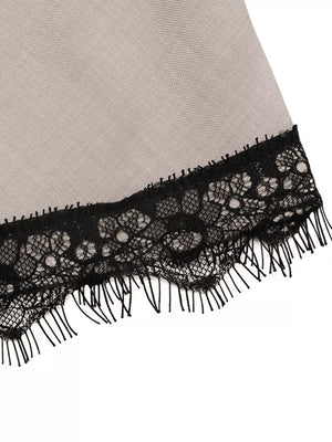 Luxe cami top in light grey with black lace trim and fringe detail.