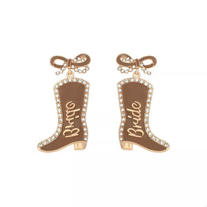 Brown bridal cowboy boot dangle earrings with crystal trim and bow detail.