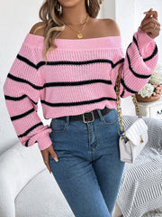 Off-the-shoulder pink striped knit pullover sweater with balloon sleeves.