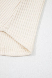 Ribbed cream shirt detail showing texture and hem