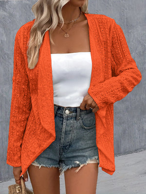 Orange open-weave cardigan with draped front and long sleeves.