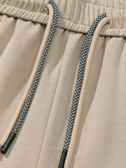Khaki lounge trousers with drawstring detail and elastic waistband