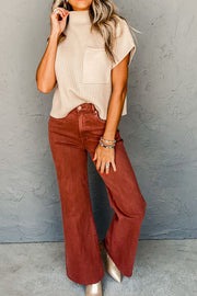 Ribbed knit mock neck top in cream with short sleeves and a chest pocket.