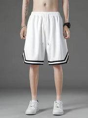 White athletic shorts with drawstring and black stripe detail on hem.