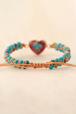 Heart stone beaded bracelet with blue beads and macrame detail.