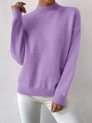 Lavender mock neck knit sweater with dropped shoulders and ribbed cuffs and hem.