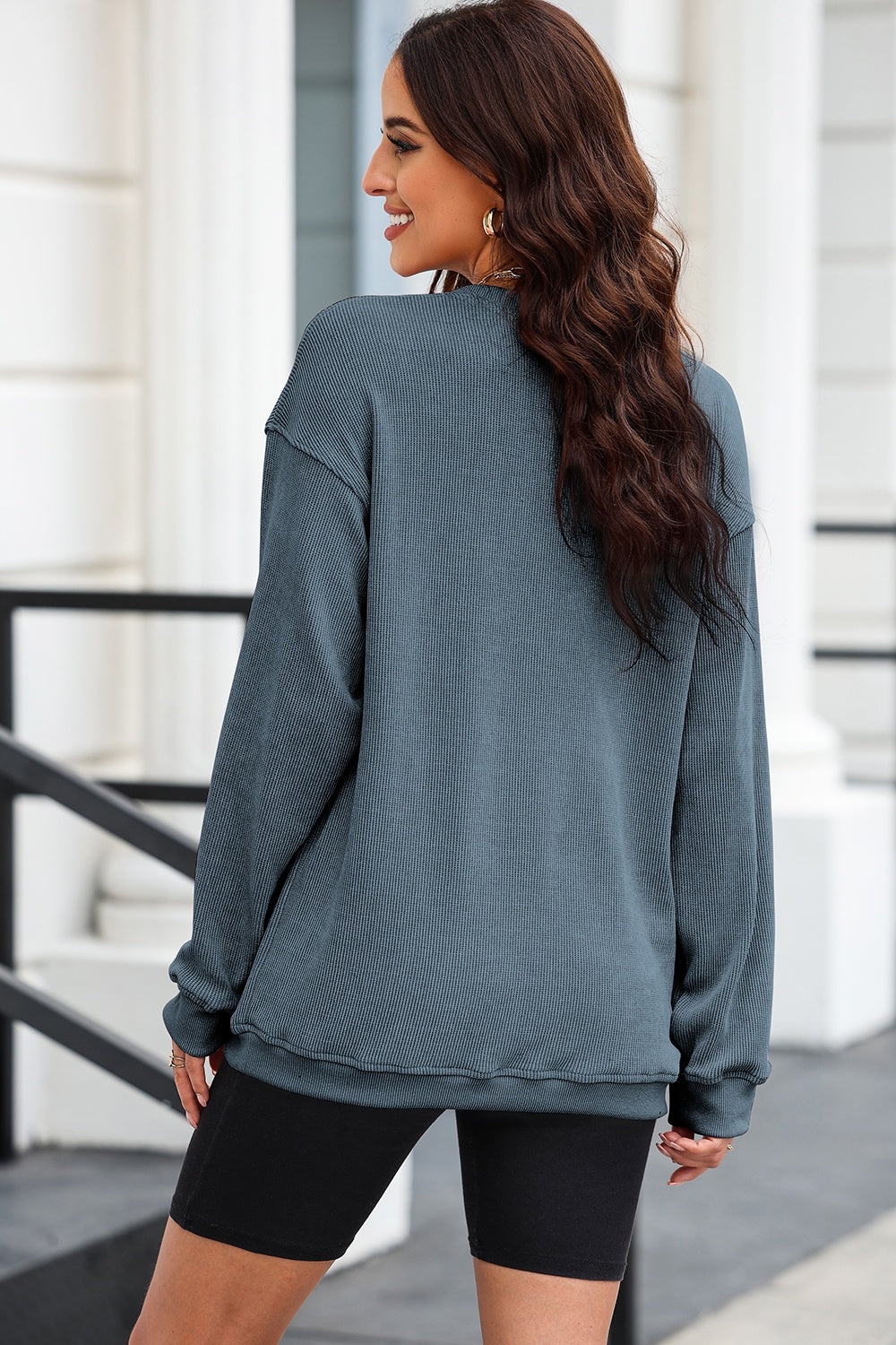 Textured ribbed crewneck pullover in Dusty Blue with long sleeves and a relaxed fit.