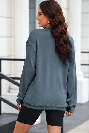 Textured ribbed crewneck pullover in Dusty Blue with long sleeves and a relaxed fit.