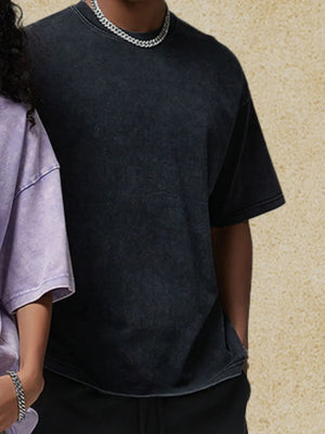 Acid wash black oversized tee with crew neck and short sleeves.