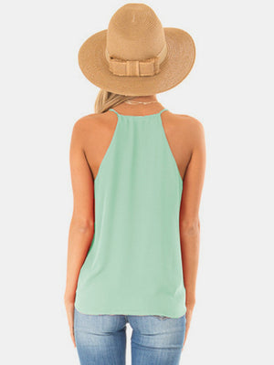 Misty Blue draped crossover halter cami with a high neckline.