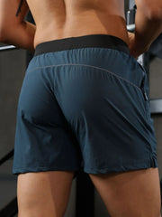 Peacock Blue athletic shorts with black waistband and reflective piping detail.
