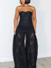 Black lace cutout tube top and wide-leg pants set with intricate detailing.