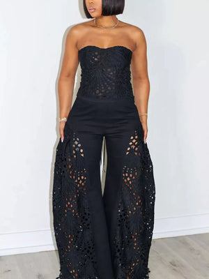 Black lace cutout tube top and wide-leg pants set with intricate detailing.