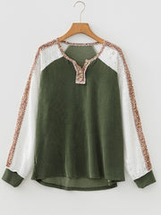 Dark green waffle knit henley top with lace sleeves and animal print accents.