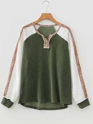 Dark green waffle knit henley top with lace sleeves and animal print accents.