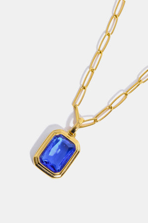 Gilded Prism Pendant Necklace with royal blue gemstone and 18K gold chain.
