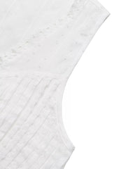 White lace-trimmed sleeveless maternity blouse with textured dot and stripe fabric.