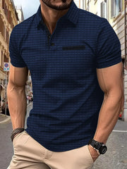 Navy textured polo shirt with contrast pocket detail and short sleeves.