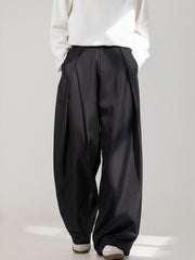 Men's black wide-leg trousers with pleats and pockets.