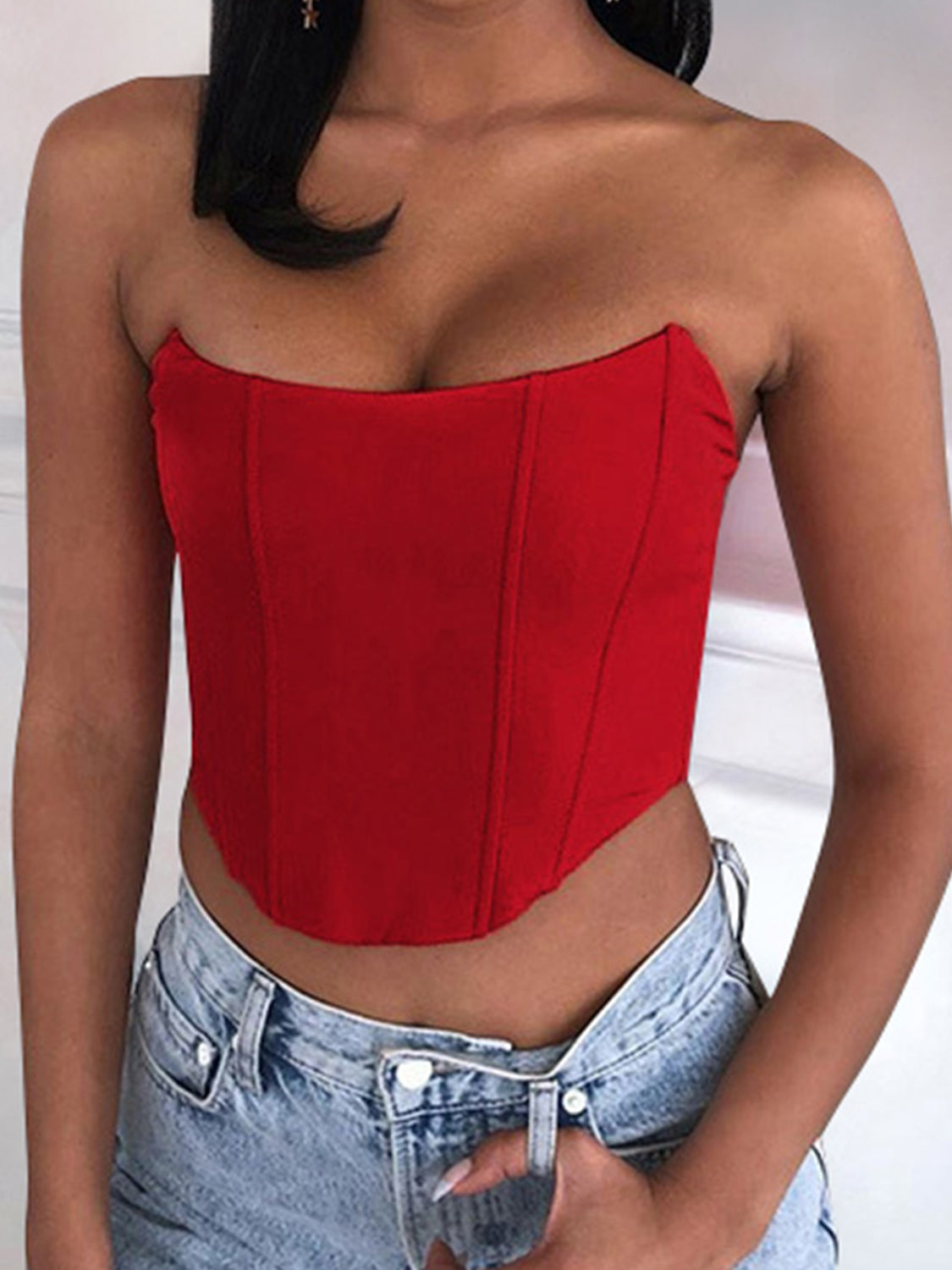 Structured corset crop top in scarlet red, strapless with boning details.