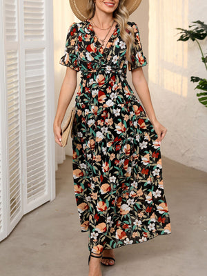 Black floral print maxi dress with V-neck, ruffles, short sleeves, and cinched waist.